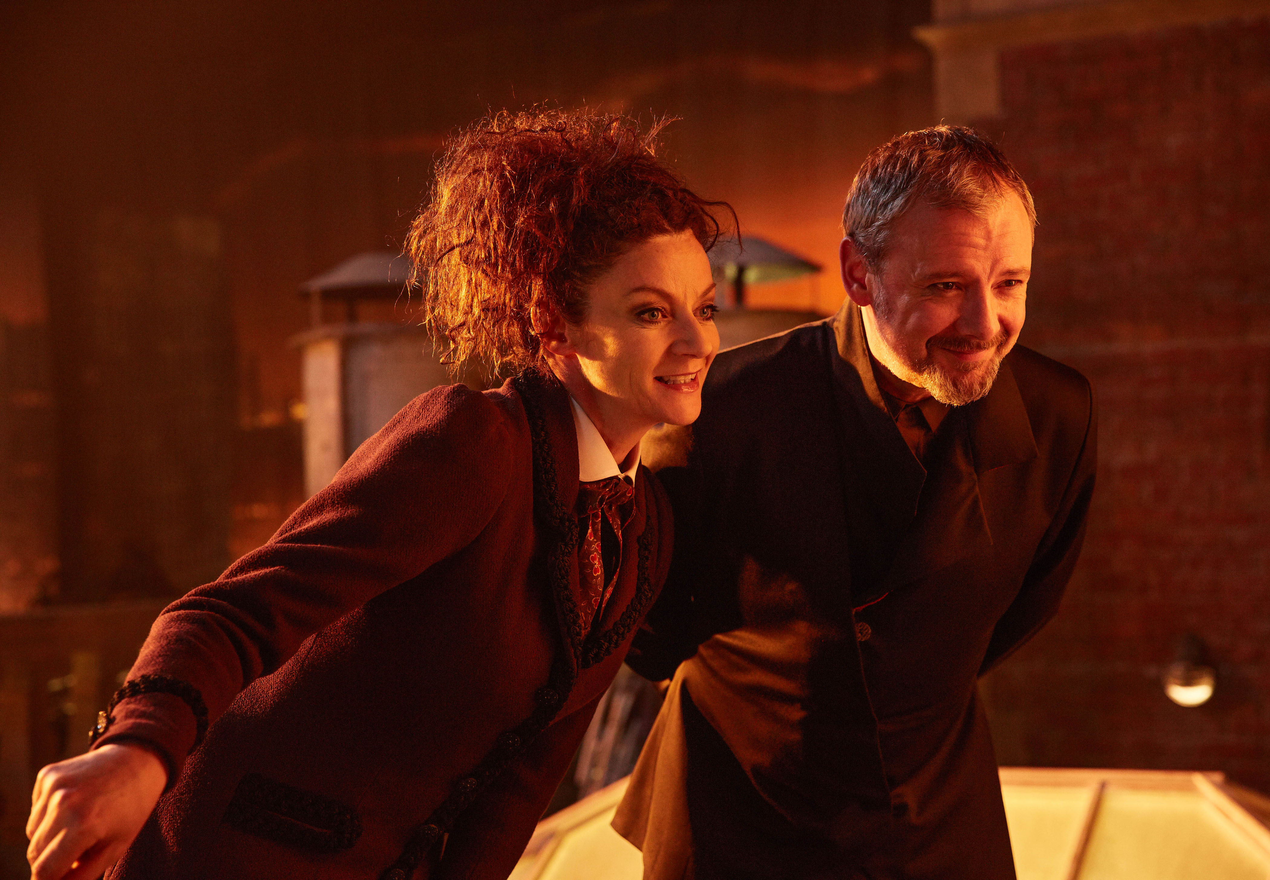 WARNING: Embargoed for publication until 00:00:01 on 27/06/2017 - Programme Name: Doctor Who S10 - TX: 01/07/2017 - Episode: n/a (No. 12) - Picture Shows: ***EMBARGOED UNTIL 00:01hrs 27th JUNE 2017*** Missy (MICHELLE GOMEZ), The Master (JOHN SIMM) - (C) BBC/BBC Worldwide - Photographer: Simon Ridgway WARNING: Embargoed for publication until 00:00:01 on 27/06/2017 - Programme Name: Doctor Who S10 - TX: 01/07/2017 - Episode: n/a (No. 12) - Picture Shows: ***EMBARGOED UNTIL 00:01hrs 27th JUNE 2017*** Missy (MICHELLE GOMEZ), The Master (JOHN SIMM) - (C) BBC/BBC Worldwide - Photographer: Simon Ridgway