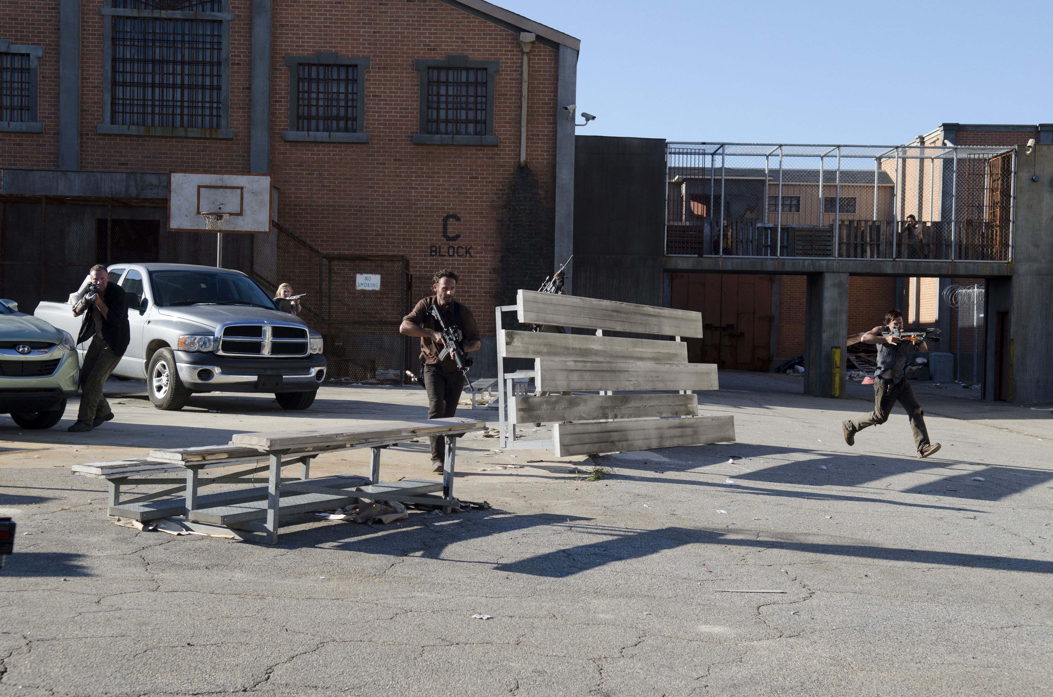 Merle Dixon (Michael Rooker), Beth Greene (Emily Kinney), Rick Grimes (Andrew Lincoln), Daryl Dixon (Norman Reedus) - The Walking Dead - Season 3, Episode 11 - Photo Credit: Gene Page/AMC Merle Dixon (Michael Rooker), Beth Greene (Emily Kinney), Rick Grimes (Andrew Lincoln), Daryl Dixon (Norman Reedus) - The Walking Dead - Season 3, Episode 11 - Photo Credit: Gene Page/AMC